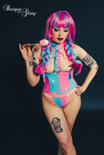 Load image into Gallery viewer, Person wearing a colorful outfit with pink and blue accents, holding a lollipop against a dark background.